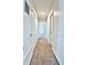 Bright hallway with carpet flooring, multiple closets, and access to different rooms at 7185 S Gaylord St # A, Littleton, CO 80122