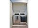 Laundry closet equipped with stainless steel washer and dryer at 7185 S Gaylord St # A, Littleton, CO 80122
