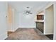 Large living area boasts neutral carpet, ceiling fan, breakfast bar and lots of natural light from the window at 7185 S Gaylord St # A, Littleton, CO 80122