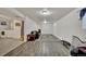 Finished basement with wood-look flooring, a sofa, rug and laundry area at 2279 S Lewiston St, Aurora, CO 80013