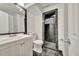 Modern bathroom featuring sleek vanity, toilet, and tiled standing shower at 2279 S Lewiston St, Aurora, CO 80013