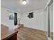 Bedroom with a window, dark curtains, hard wood flooring and white walls at 2279 S Lewiston St, Aurora, CO 80013