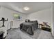 Bedroom with a queen bed, closet, window, light grey carpet and white walls at 2279 S Lewiston St, Aurora, CO 80013