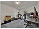 Bedroom with a window, white walls, light grey carpet, and a black desk and chair at 2279 S Lewiston St, Aurora, CO 80013