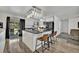 Modern kitchen featuring white cabinets, stainless appliances, and a breakfast bar with seating at 2279 S Lewiston St, Aurora, CO 80013