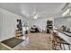 Open living space features light wood flooring, a ceiling fan and neutral walls at 2279 S Lewiston St, Aurora, CO 80013