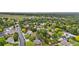 A lush, green neighborhood filled with mature trees and well-maintained homes on a sunny day at 13052 W Asbury Pl, Lakewood, CO 80228