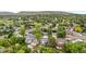 An aerial view of a neighborhood with mature trees and lush landscaping at 13052 W Asbury Pl, Lakewood, CO 80228