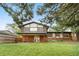 View of the house's backyard featuring patio, ample grass and privacy fencing at 13052 W Asbury Pl, Lakewood, CO 80228