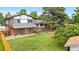 Expansive backyard featuring mature landscaping and a covered patio at 13052 W Asbury Pl, Lakewood, CO 80228