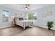 Calm bedroom with a ceiling fan and big windows at 13052 W Asbury Pl, Lakewood, CO 80228