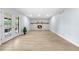 Spacious living room featuring a stone fireplace and access to the backyard at 13052 W Asbury Pl, Lakewood, CO 80228