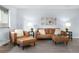 Stylish living room with leather furniture and decor at 13052 W Asbury Pl, Lakewood, CO 80228