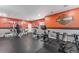 Basement home gym with various exercise machines and rubber floor at 2627 Hillcroft Ln, Castle Rock, CO 80104