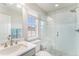Bright bathroom with glass shower, window and marble counters at 2627 Hillcroft Ln, Castle Rock, CO 80104