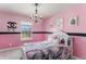 Bedroom decorated with pink walls and Chanel theming at 2627 Hillcroft Ln, Castle Rock, CO 80104