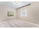 Neutral bedroom with plush carpet, window and artwork at 2627 Hillcroft Ln, Castle Rock, CO 80104