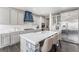 Spacious kitchen boasting a large center island with seating, custom cabinets, and modern appliances at 2627 Hillcroft Ln, Castle Rock, CO 80104