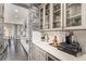 Convenient kitchen with bar, stone detail, and ample countertop space at 2627 Hillcroft Ln, Castle Rock, CO 80104