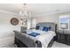 The main bedroom offers a chandelier, decorative rug, and access to a spa-like ensuite bathroom at 2627 Hillcroft Ln, Castle Rock, CO 80104