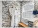 The bathroom showcases a stone accent wall, decorative window, and comfortable bench seating at 2627 Hillcroft Ln, Castle Rock, CO 80104