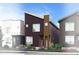 Modern home exterior with dark siding, clean lines, and professional landscaping at 1606 W 166Th Ave, Broomfield, CO 80023