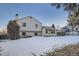 Home featuring a wooden deck in the backyard, perfect for outdoor relaxation and entertaining at 7009 S Forest Ct, Centennial, CO 80122