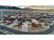 Panoramic aerial view of a neighborhood showcasing modern homes with solar panels and mountain backdrop at 19973 W 94Th Ln, Arvada, CO 80007