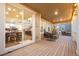 Covered back porch featuring wood flooring and cozy outdoor seating for relaxing and entertaining at 19973 W 94Th Ln, Arvada, CO 80007