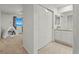 Bright bedroom with a sliding closet, tent, and a bathroom with a sink and vanity at 19973 W 94Th Ln, Arvada, CO 80007