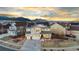 Inviting two-story home featuring a three-car garage, covered porch, solar panels, and mountain views at 19973 W 94Th Ln, Arvada, CO 80007