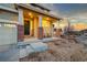 Charming front porch with brick accents, seating, and a warm welcome at 19973 W 94Th Ln, Arvada, CO 80007