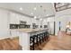 Modern kitchen featuring a large island with ample counter space and seating at 19973 W 94Th Ln, Arvada, CO 80007