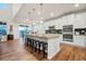 Spacious kitchen featuring a large island, modern appliances, and ample seating at 19973 W 94Th Ln, Arvada, CO 80007