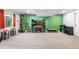 Spacious basement featuring a large TV at 8370 W Evans Pl, Lakewood, CO 80227