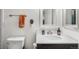 Clean bathroom with a modern vanity, ample counter space, and a towel bar at 8370 W Evans Pl, Lakewood, CO 80227