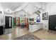 Spacious open-plan dining area with large windows, modern decor, and stylish accents, perfect for entertaining at 8370 W Evans Pl, Lakewood, CO 80227