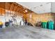 Spacious garage offers ample storage space, with exposed wood framing and high ceilings at 8370 W Evans Pl, Lakewood, CO 80227