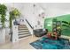 Bright open living room featuring a staircase at 8370 W Evans Pl, Lakewood, CO 80227