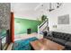 Bright living room featuring a fireplace, staircase and hardwood flooring at 8370 W Evans Pl, Lakewood, CO 80227