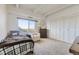 Bright bedroom with large window, natural light, closet space, and comfortable furnishings at 7877 E Mississippi Ave # 506, Denver, CO 80247