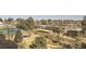 Panoramic exterior shot featuring manicured landscaping, mature trees and the community's covered parking area at 7877 E Mississippi Ave # 506, Denver, CO 80247