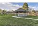 Charming community gazebo with outdoor seating, set on a well-maintained lawn area for relaxation at 7877 E Mississippi Ave # 506, Denver, CO 80247