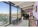 Bright home office with floor-to-ceiling windows and exterior balcony offering expansive city views at 7877 E Mississippi Ave # 506, Denver, CO 80247