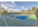 Well-maintained tennis and pickleball courts with clear blue skies for a great outdoor experience at 7877 E Mississippi Ave # 506, Denver, CO 80247