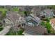 Aerial view of a two-story home with solar panels and a nicely manicured lawn in a residential area at 10052 Sage Sparrow Ct, Highlands Ranch, CO 80129