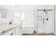 Bright bathroom features a glass enclosed shower, soaking tub, and granite vanity at 10052 Sage Sparrow Ct, Highlands Ranch, CO 80129