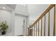 Welcoming entryway boasts a soaring ceiling, wood staircase, and a bright front door with sidelight window at 10052 Sage Sparrow Ct, Highlands Ranch, CO 80129