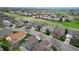 Wide aerial view of a residential neighborhood with mature landscaping and trees at 10052 Sage Sparrow Ct, Highlands Ranch, CO 80129
