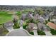 Aerial shot showing a residential community with mature landscaping and green spaces at 10052 Sage Sparrow Ct, Highlands Ranch, CO 80129